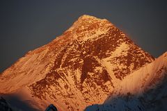 
Mount Everest North and Southwest faces burn red at sunset from Gokyo Ri.

